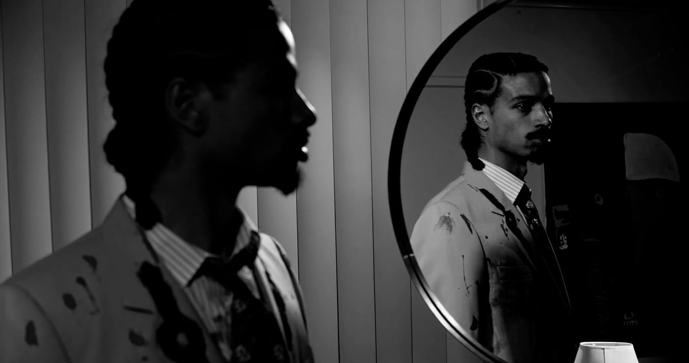 Two silhouettes divided by a doorframe